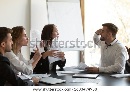 Businesspeople argue with client dissatisfied with contract terms, mad group of people have dispute with business partner discontented with agreement, claim money back, mistake caused financial loss Royalty-Free Stock Photo #1633494958