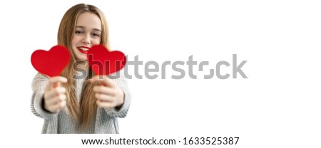 Close-up portrait of nice attractive lovely girlish cheerful girl holding in hands two heart symbol cards closing eyes isolated on white background
