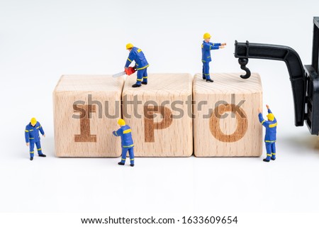 Cube wooden block with alphabets combine the word IPO with miniature people men help building with crane on white background using as Initial Public Offerings, company going public in stock market. Royalty-Free Stock Photo #1633609654