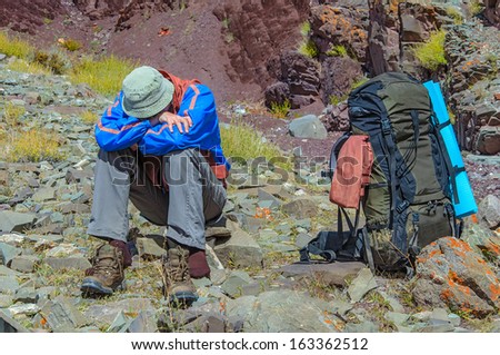 Trekker resting in height mountain  India Royalty-Free Stock Photo #163362512