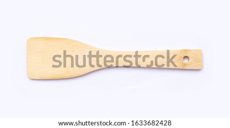Wooden spatula isolated on white background with clipping path. Kitchen utensil. Royalty-Free Stock Photo #1633682428