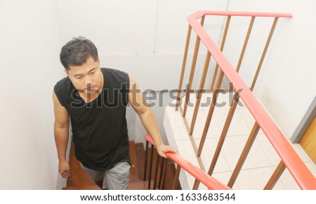 A man walking up the stairs