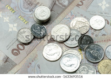 Close up  coin and banknote thai Bath currency money . Background concept for thailand financial and  economy.