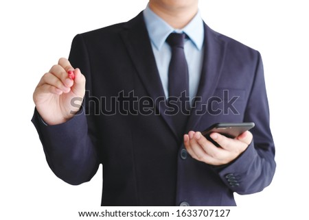 Businessman hand holding  mobile phone and marker standing isolated on white background, Man in suit writing for presentation while holding smartphone, business and technology concept