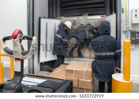 Transporting goods in the loading goods of the freezing warehouse. Storage for Ready-made foods or Ready-to-Eat Foods. Export-Import Logistics system concept. Royalty-Free Stock Photo #1633722919