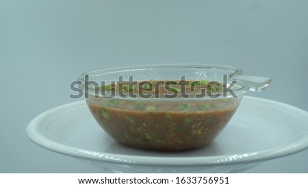 Chili paste in white background. Thai food to eat with boiled vegetables.