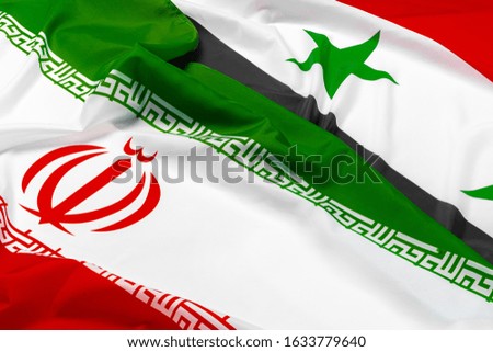 Flags of Syria and Iran together close up