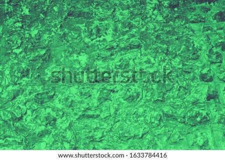 Wall stone texture background. Green old grunge surface, stone vintage texture. Voluminous background