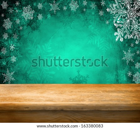 Empty wooden deck table with winter background. Ready for product display montage.