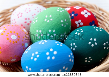 Close-up. Colorful easter eggs on a basket.