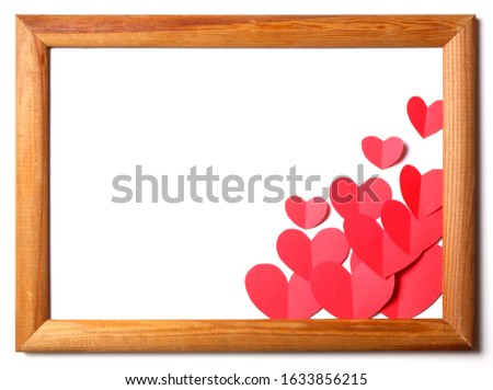 Wooden frame with red paper hearts cutouts on white background with free space for custom text. Good love, valentines day, womans day, wedding banner, card, invitation, congratulation template.