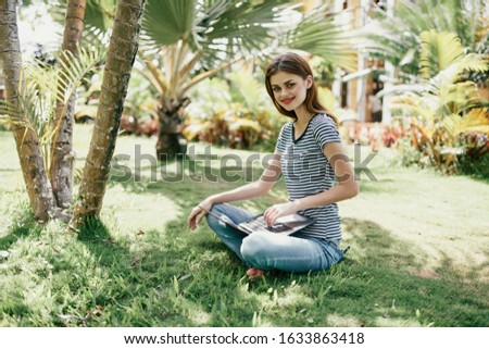 woman young girl with laptop outdoors