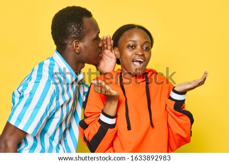 yellow background fun man and woman african appearance