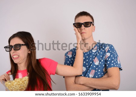 woman holds a hand on the cheek of a man emotions 3D glasses portrait