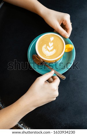 selective focus, beautiful cappuccino mug with a pattern