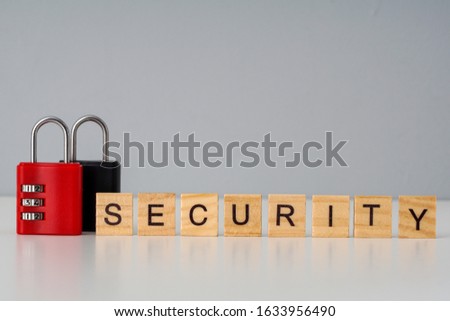 Security management concept with a security wording on a wooden cube and numbering locked