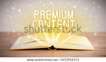 Open book with PREMIUM CONTENT inscription, social media concept