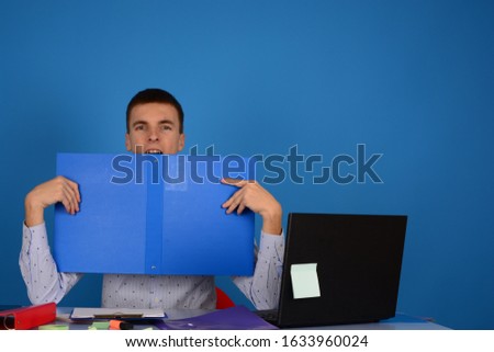 a man sits in an office with documents in his hands a business job