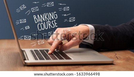 Businessman working on laptop with BANKING COURSE inscription, online shopping concept Royalty-Free Stock Photo #1633966498