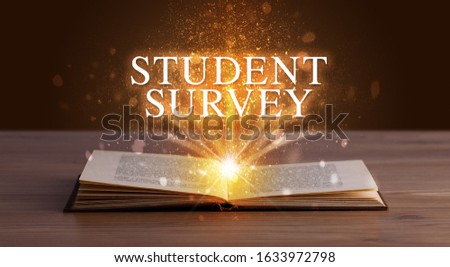 STUDENT SURVEY inscription coming out from an open book, educational concept