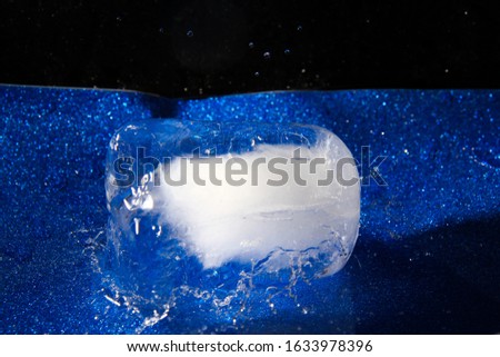 Ice block on blue background