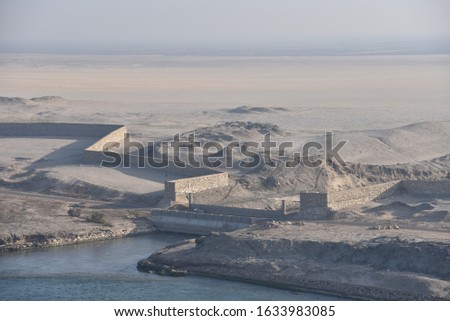 Landscape of the Suez Canal. View from transiting cargo ship.