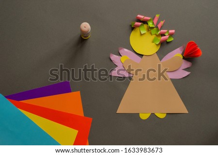 blank for crafts with children from colored paper on a gray background angel with heart theme Valentine's Day