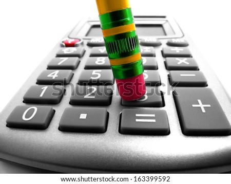 Closeup of a pencil pushing buttons on a calculator doing math calculations