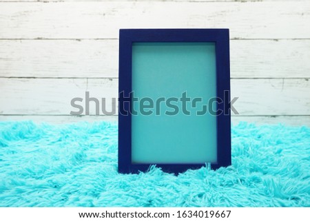 Mock-up space Photo Frame on wooden bacground