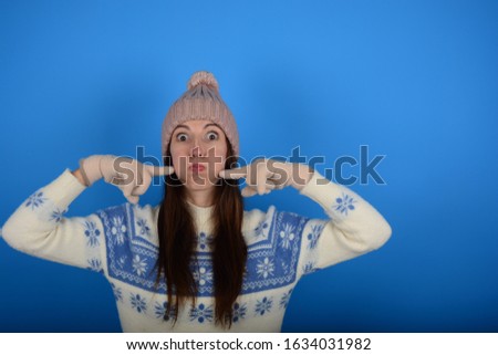young woman in winter sweater advertising fashion emotions