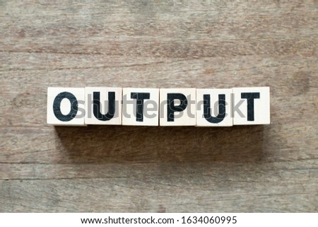 Letter block in word output on wood background Royalty-Free Stock Photo #1634060995