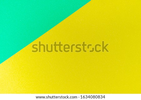 Texture of a green and yellow paper for background.