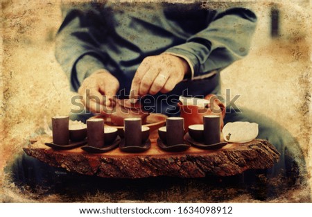 Tea ritual. Old photos effect with border.