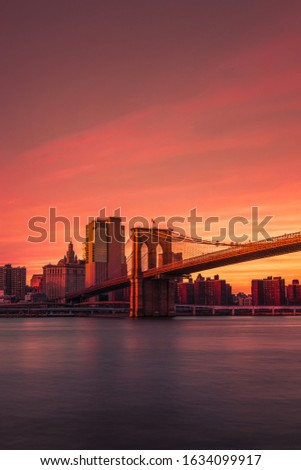 Sun setting by brooklyn bridge