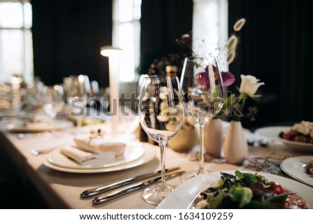 Elegant table set  for a romantic dinner. Catering, hospitality and private dining Royalty-Free Stock Photo #1634109259