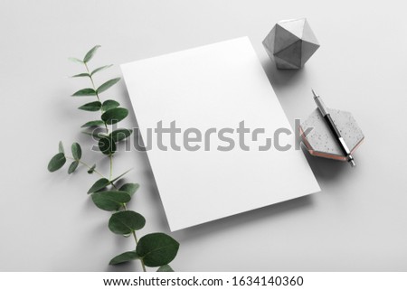 Real photo, stationery branding mockup template to place your design, isolated on light grey background, with concrete, copper, granite and floral elements. Royalty-Free Stock Photo #1634140360