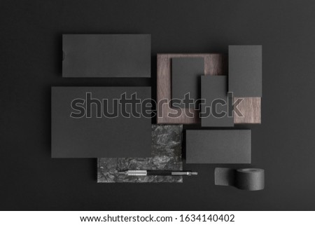 Real photo, black stationery branding mockup template, on black background to place your design. Royalty-Free Stock Photo #1634140402