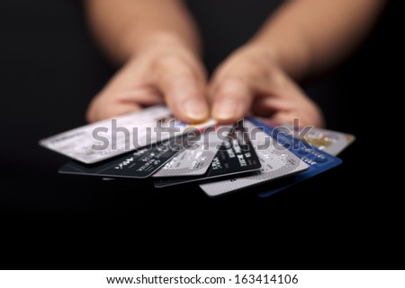 A concept image of credit cards fanned out to pick one. Royalty-Free Stock Photo #163414106