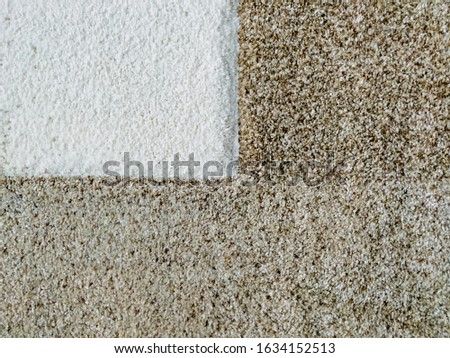 Modern and soft woolen carpet rug sample in brown and white colors for interior design style decoration and an interesting wallpaper