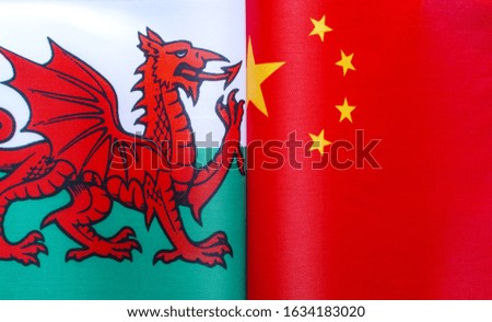 fragments of national flags of Wales and China close-up