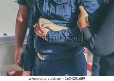 Funeral and sadness,Funeral service,Holding hands to cheer,Funeral ceremonies in .Black dress.Blue dress Royalty-Free Stock Photo #1634201689