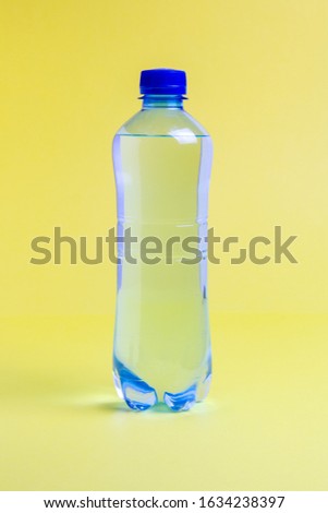 plastic water bottle on a yellow background
