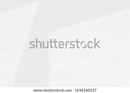 Light and shadow hits the wall of the building. Abstract background.
