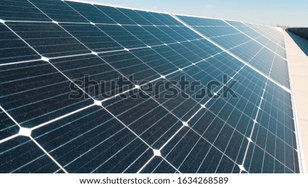 Photo solar photovoltaic panels. Flat roof photovoltaic solar panels absorb sunlight as an energy source to generate sustainable electricity
