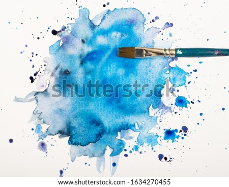 blue watercolor stain with brush isolated on white