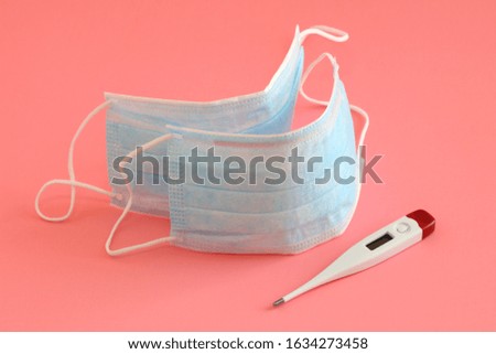 Medical face mask isolated on pink background. 