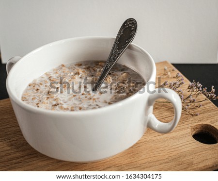 Breakfast at the early morning. Buckwheat with milk in the bowl. Healthy food and proper nutrition. Can be on the menu at cafeteria.