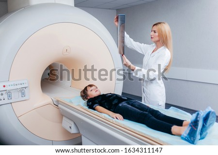 Young female doctor checking a mri picture