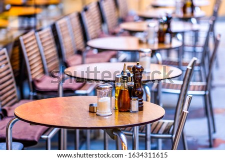 table and chairs at a cafe in vienna