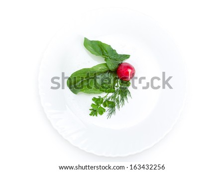Close up of radish salad on plate, isolated on white. Concept of healthy lifestyle and dieting